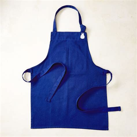 A Blue Apron With Two Straps Hanging From It