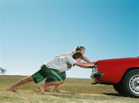 Couple Pushing Car Stock Photo Download Image Now Istock