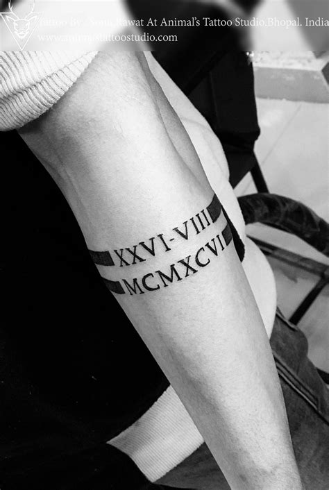 Roman Numeral Tattoo Arm