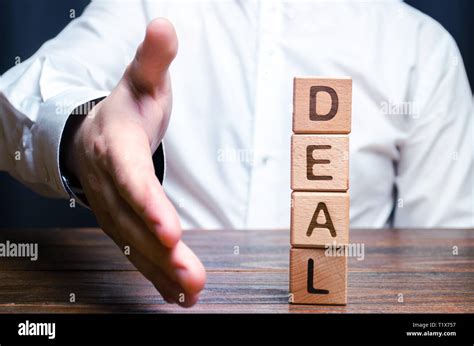 The Businessman Holds Out His Hand To Make A Deal Concept Of A